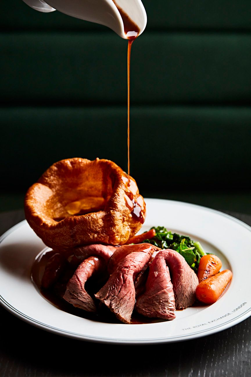 Sunday roast with beef, vegetables, yorkshire pudding and gravy.