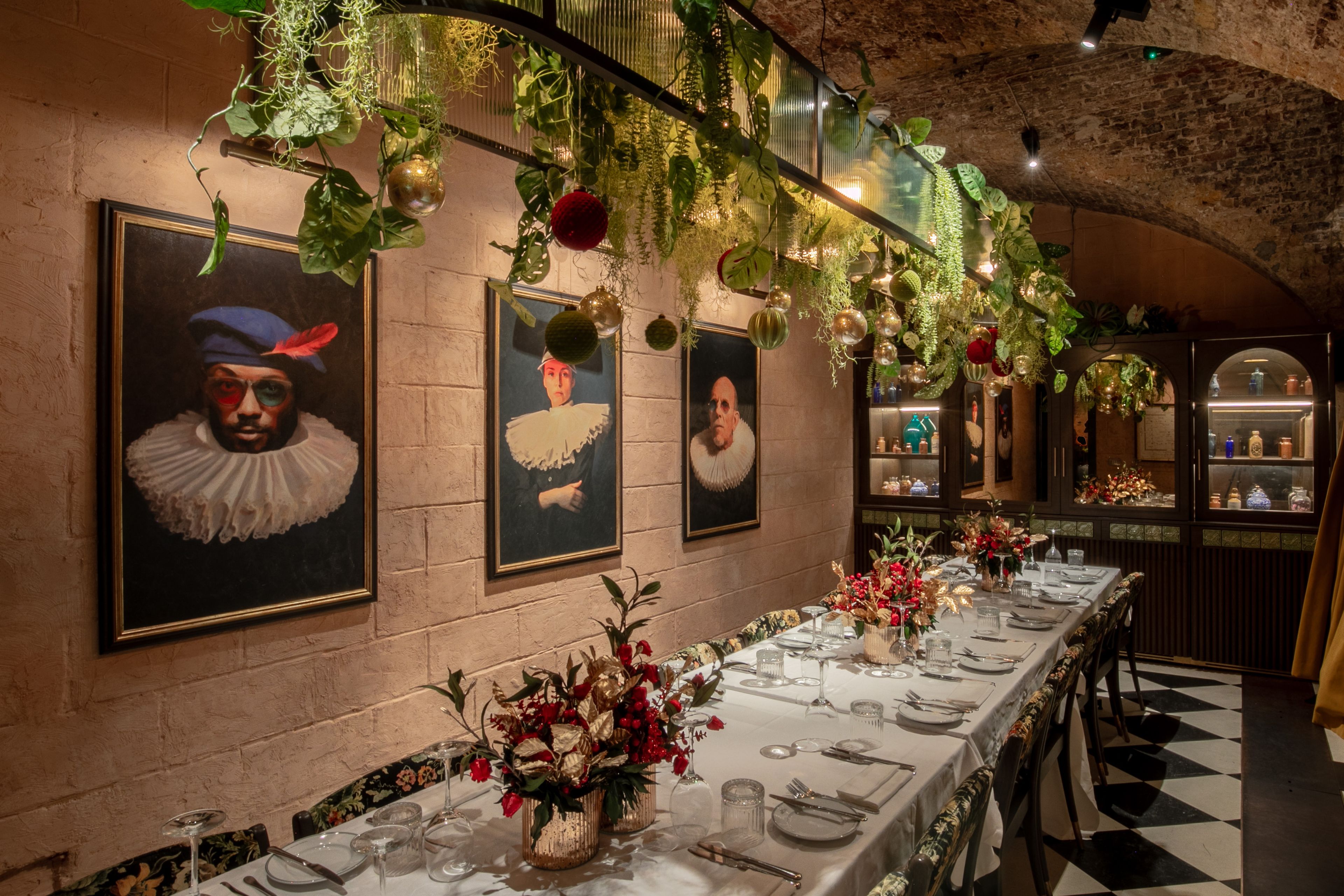 Private dining room set up for Christmas meal with festive decorations.