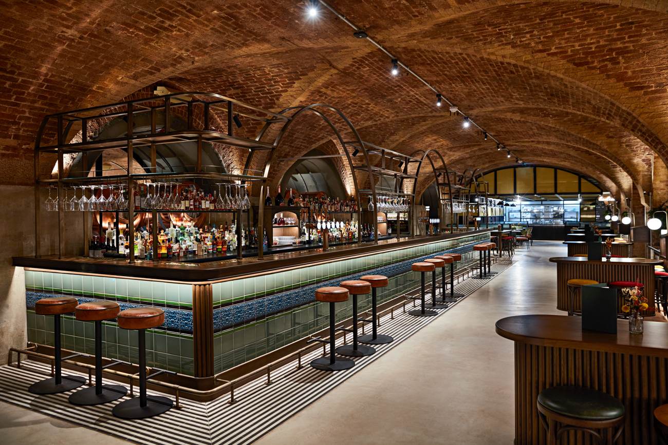 Spacious bar area with vaulted brickwork ceilings.